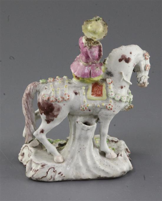 An extremely rare Girl-on-a-Horse or Compass Marked group of a young lady riding a piebald horse, c.1755, h. 15cm, losses and repairs,